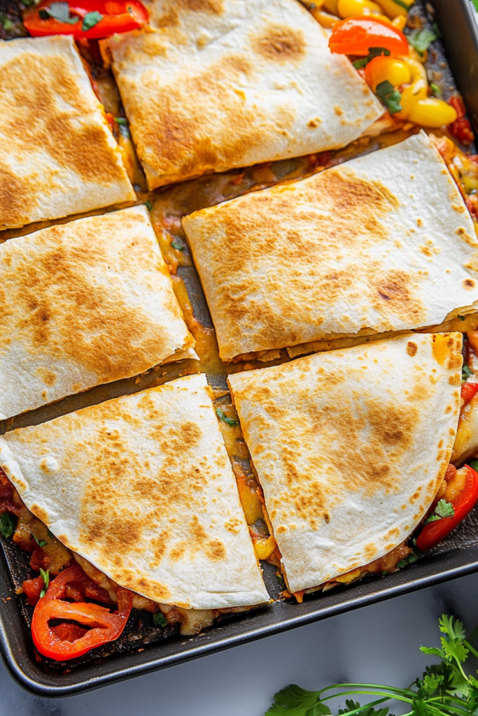 Crispy tortillas cut into triangles, filled with seasoned meat, tomatoes, and herbs.