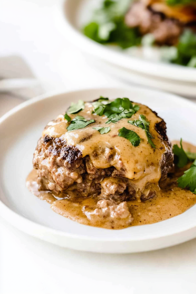 Homemade beef steak with creamy brown gravy served warm and ready to eat.