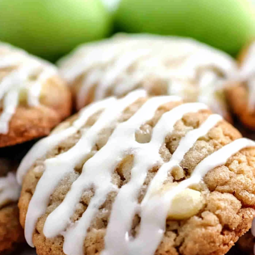 Close-up of soft, crumbly cookie texture highlighted by a thick drizzle of icing