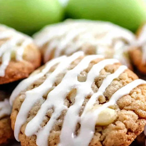 Close-up of soft, crumbly cookie texture highlighted by a thick drizzle of icing