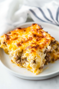 Rustic serving of casserole styled simply with browned top and rich textures.