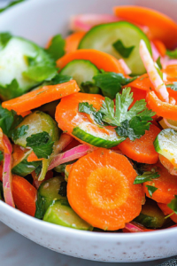 Bright and refreshing mixed veggie salad with a glossy citrus dressing