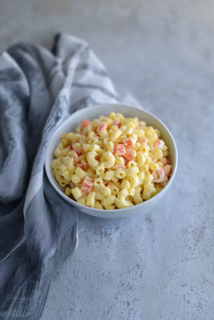Bowl of creamy pasta salad highlighting its texture and color contrast.