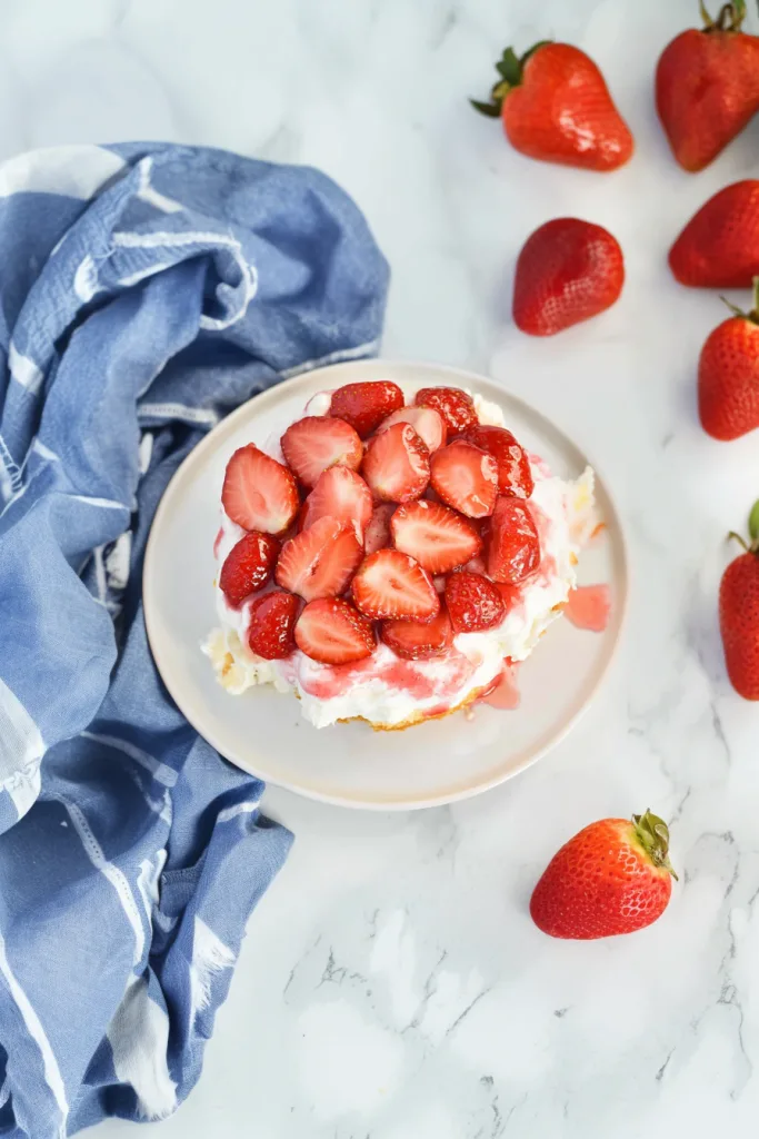 Light and fluffy strawberry dessert with layers of cream and juicy berries