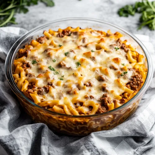 Rustic casserole presentation highlighting browned edges, creamy layers, and vibrant garnish.