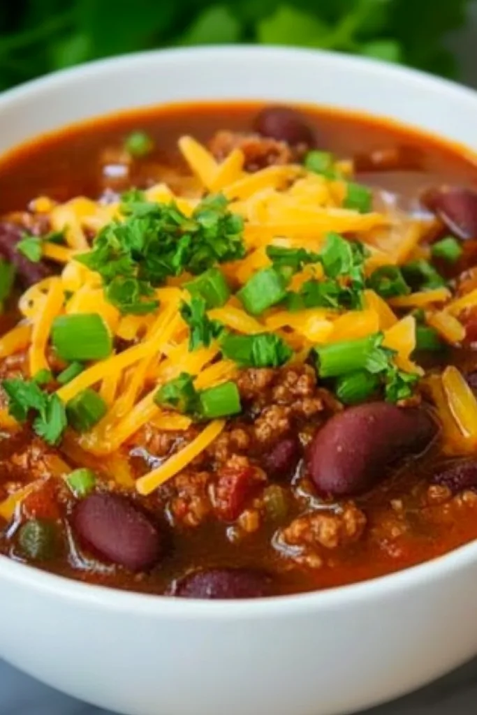 Warm chili with savory toppings, perfect for a cozy meal presentation.