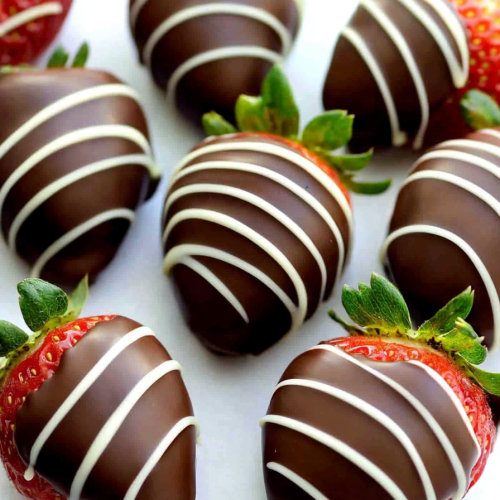 Overhead view of strawberries showcasing their vibrant color against smooth chocolate layers.