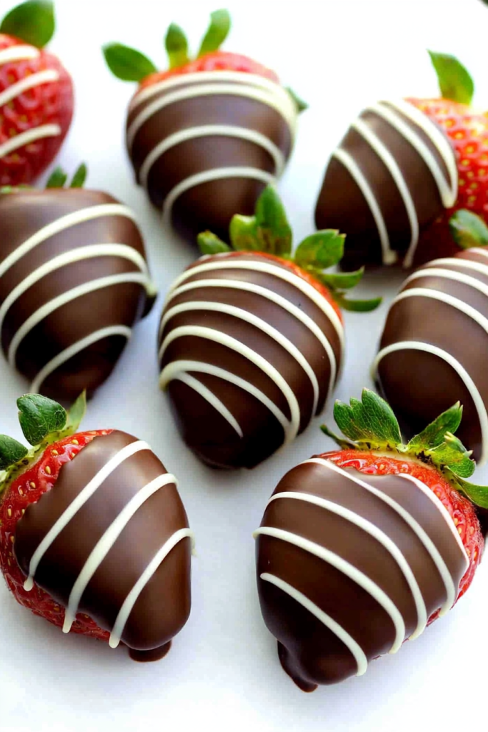 Overhead view of strawberries showcasing their vibrant color against smooth chocolate layers.