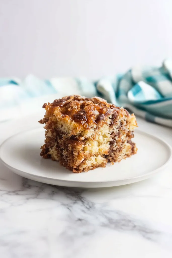 Freshly baked cake slice with a marbled interior and buttery crumb finish.