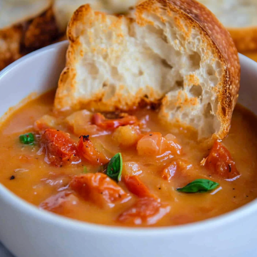 Comforting meal showing golden-brown toasted bread beside the bowl.