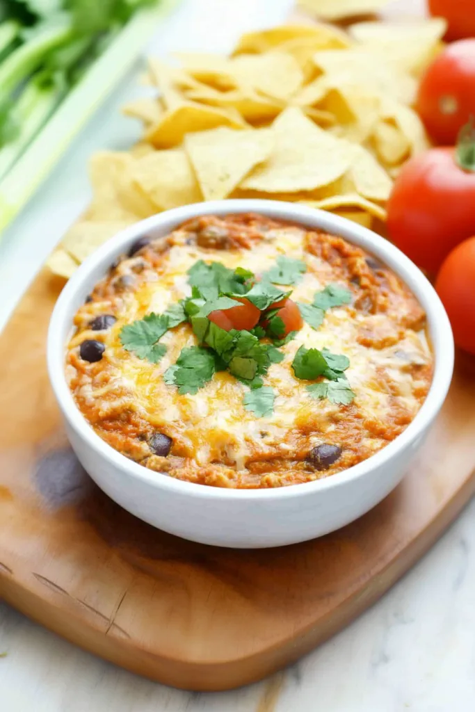 Cheesy baked appetizer presented with crisp chips for a festive snack.