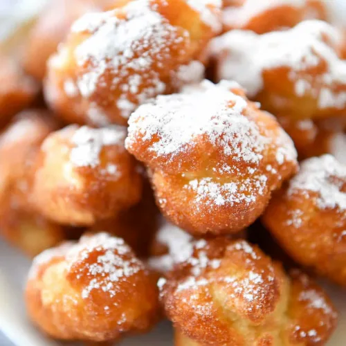 Warm fried desserts highlighting their golden crust and sweet finish.