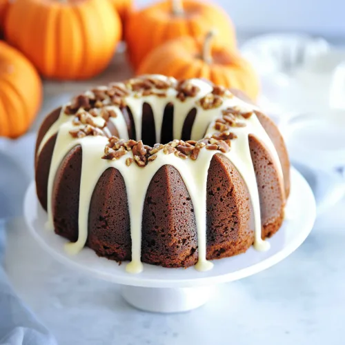 Festive autumn bundt cake with glossy icing and crunchy pecan garnish.
