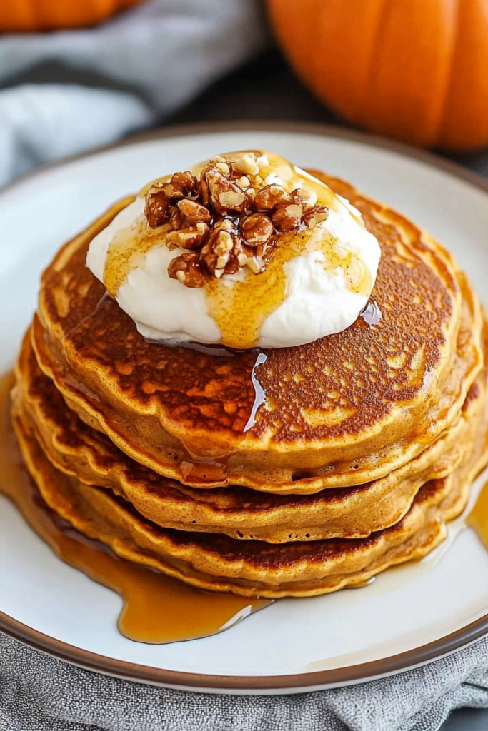Rustic serving of spiced pancakes with crisp edges and cozy fall presentation.