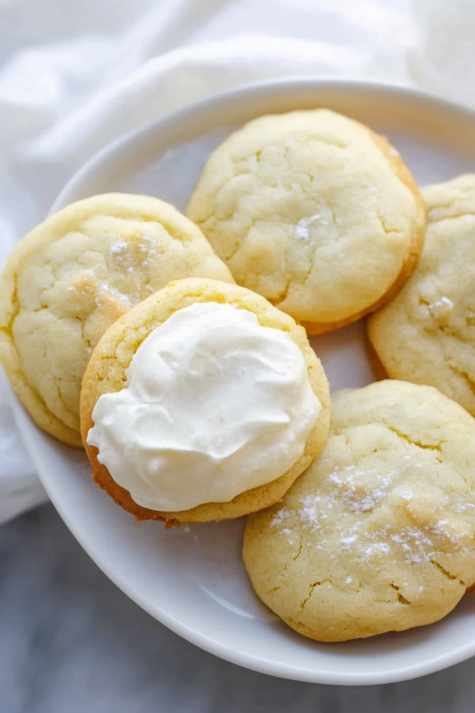 Tender sugar cookies with a light dusting of powdered sugar and smooth icing.