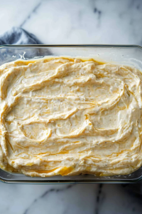 Creamy, rich spread with a smooth texture, garnished lightly for presentation.