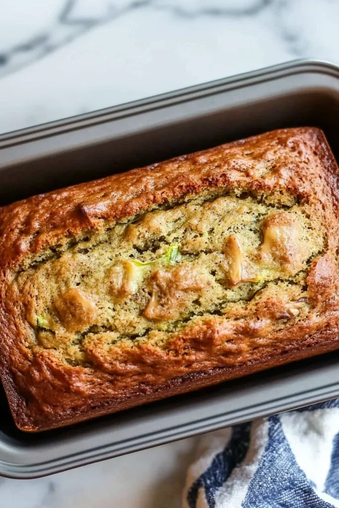 Banana zucchini bread showing a soft, wholesome interior and rustic golden crust