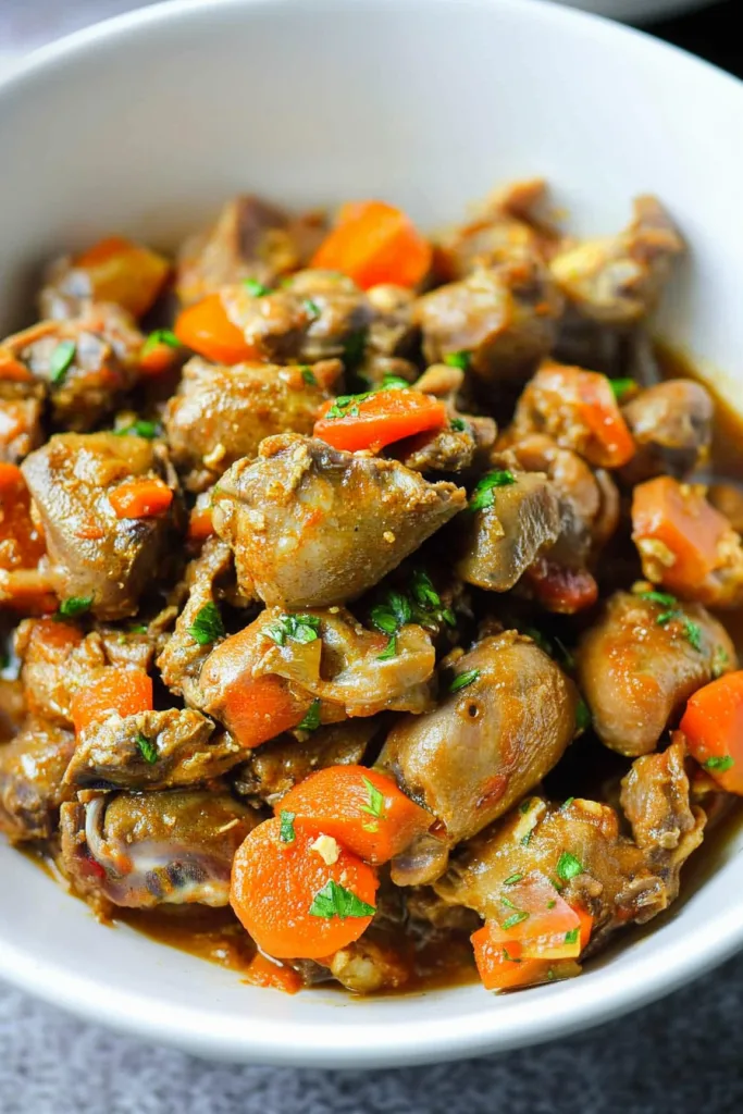 Rustic meal showing tender cuts coated in rich gravy with parsley garnish.