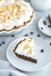 Creamy chocolate dessert with a golden meringue topping and flaky crust.