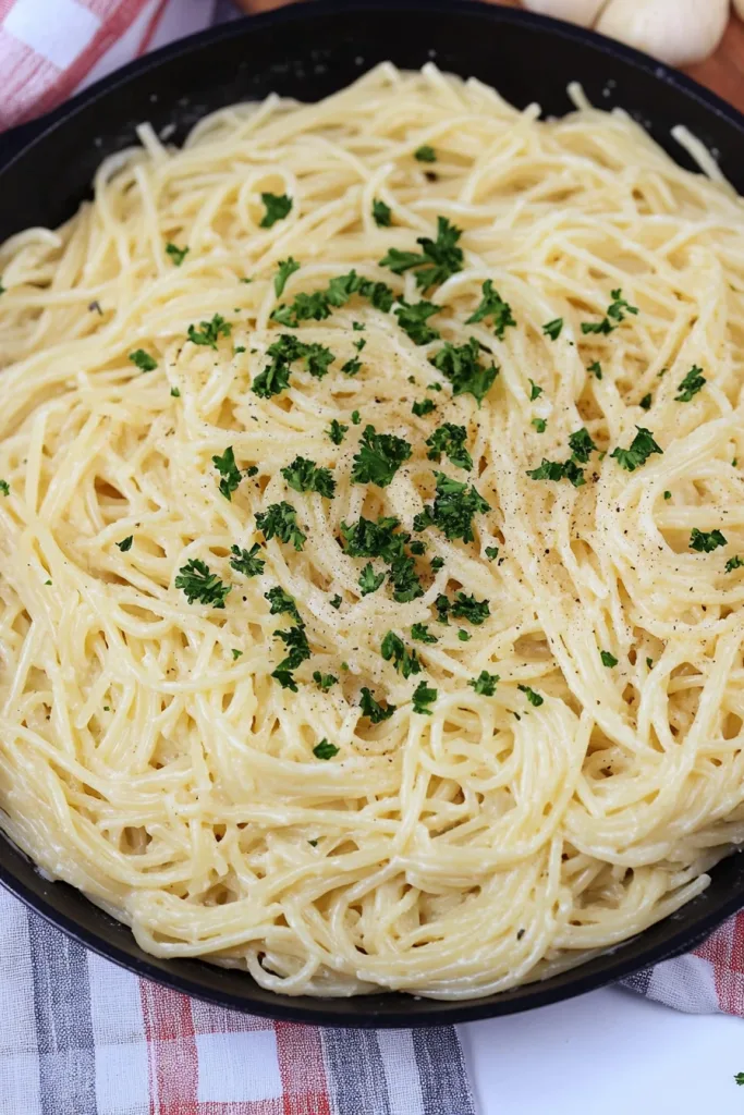 Fresh parsley sprinkled over silky pasta in light sauce