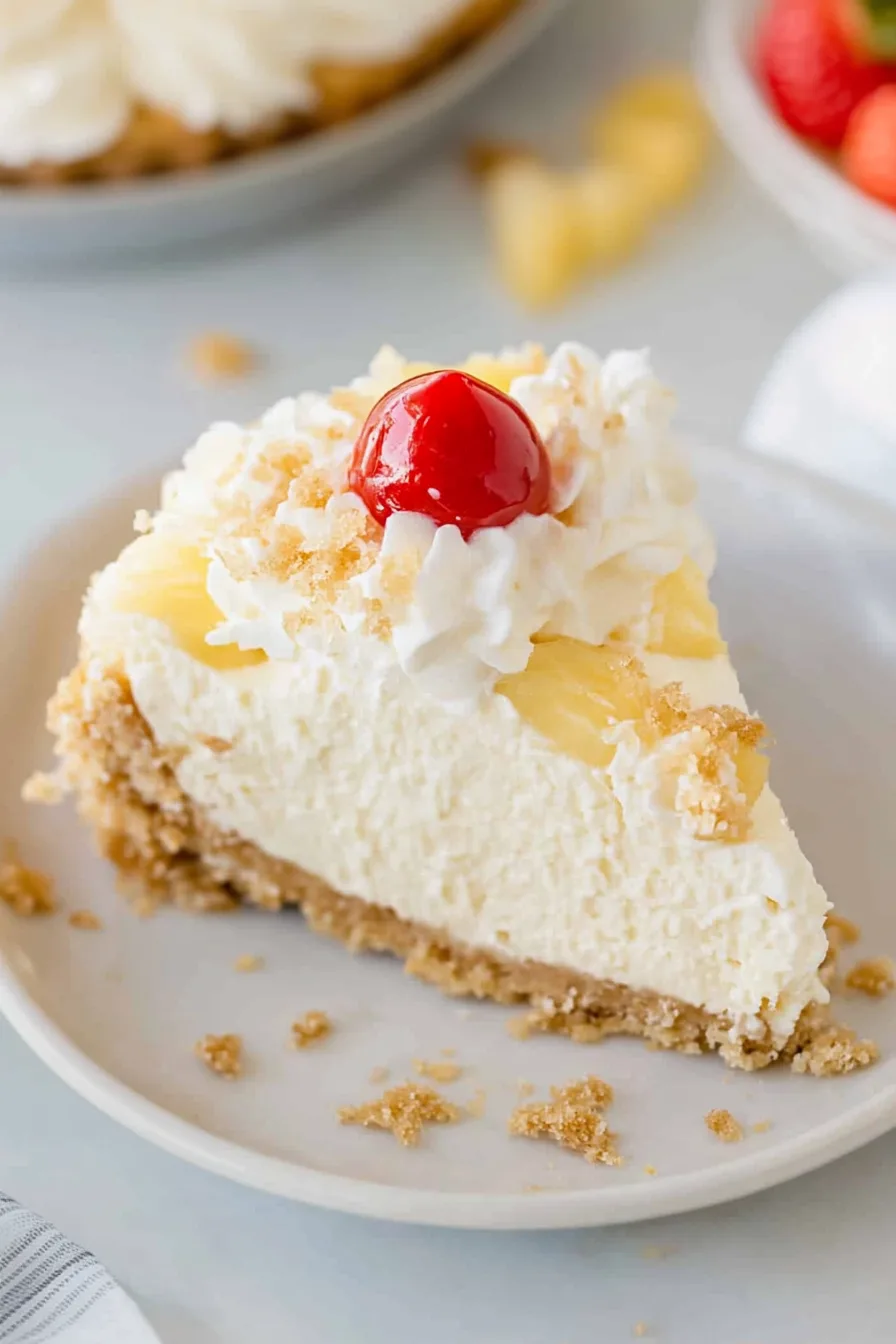 Elegant homemade dessert garnished with fruit and swirls of whipped topping