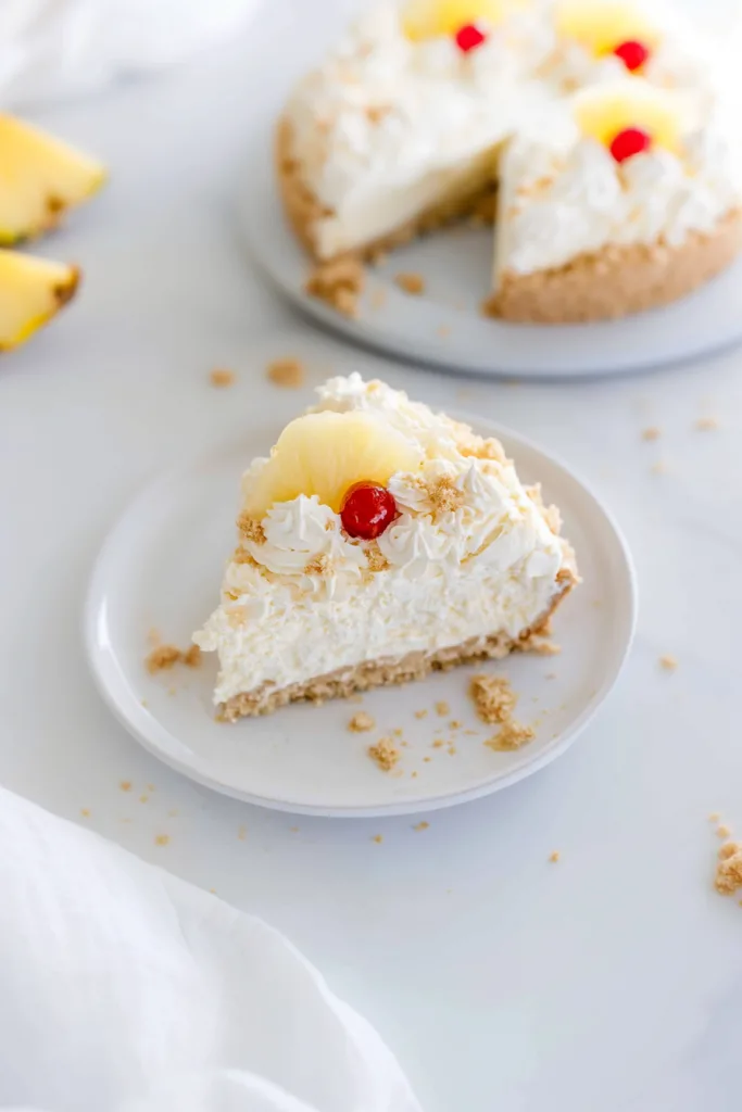 Beautifully decorated tropical-inspired dessert with pineapple garnish and creamy filling