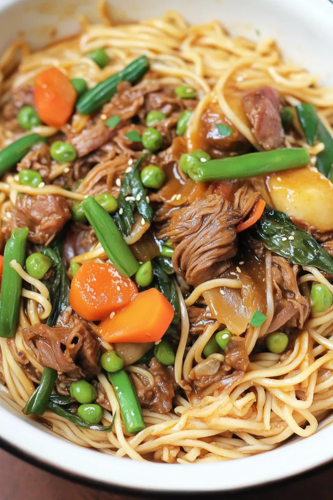 Tender beef slices mixed with vegetables and noodles in a rich sauce