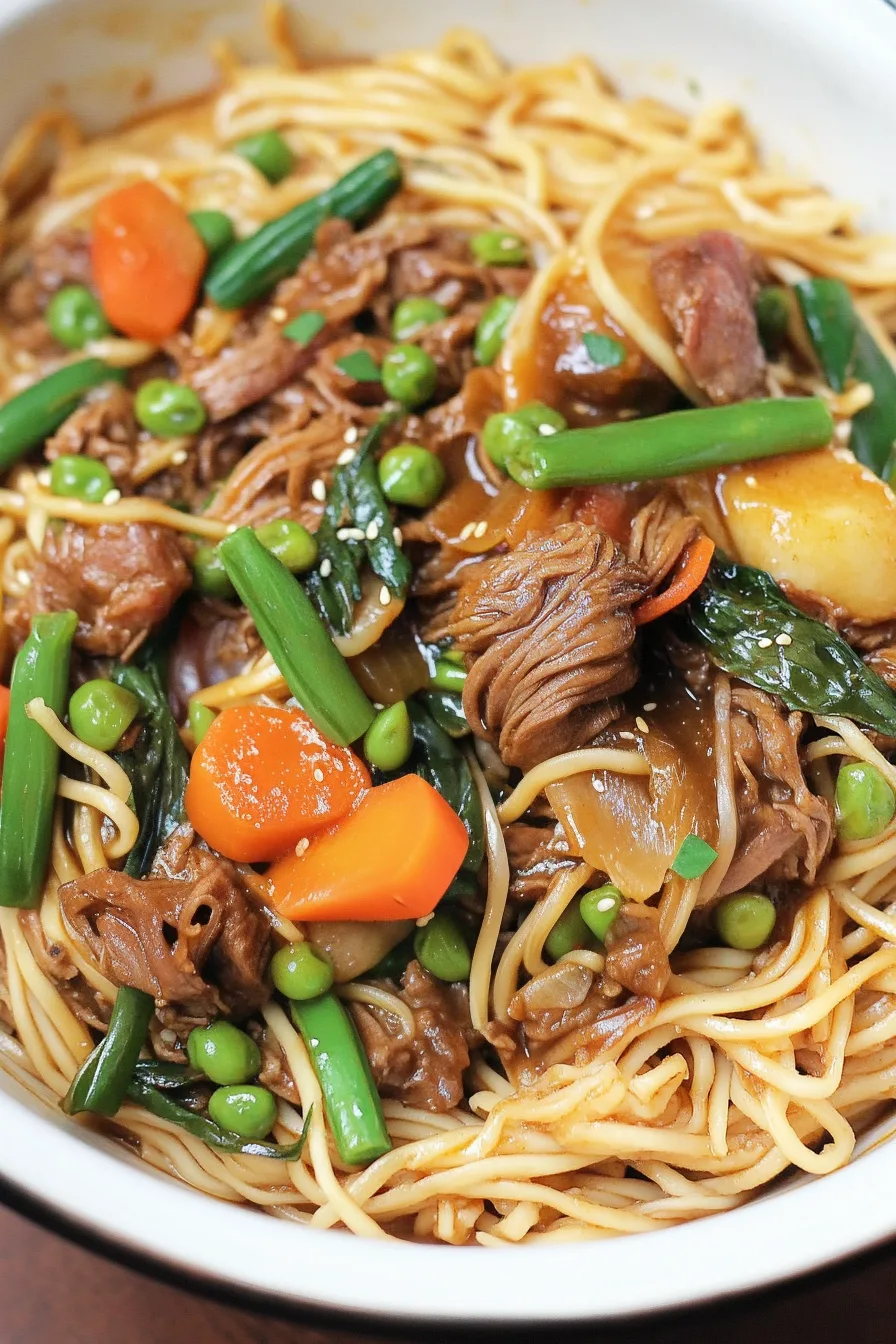 Tender beef slices mixed with vegetables and noodles in a rich sauce