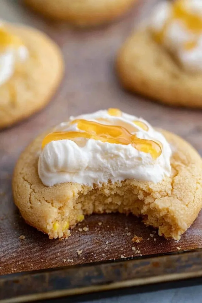 Closeโup of frosted cookie showing its crumbly texture and sweet topping.