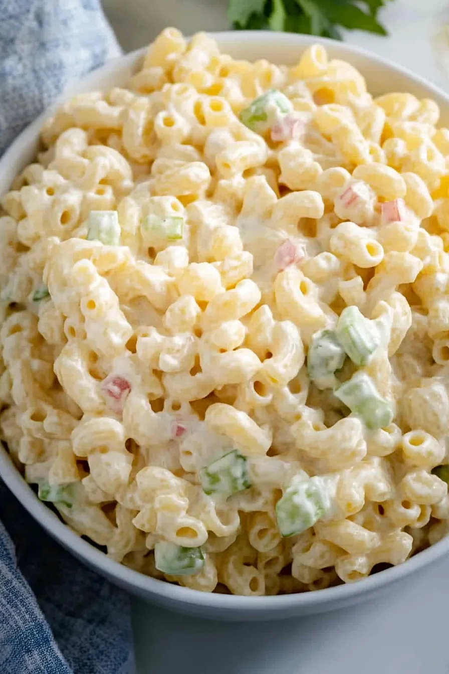 Final shot of Dolly Partonโs macaroni salad recipe, highlighting its creamy texture and fresh crunch.