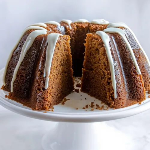 Whole cake on display stand with soft background emphasizing texture