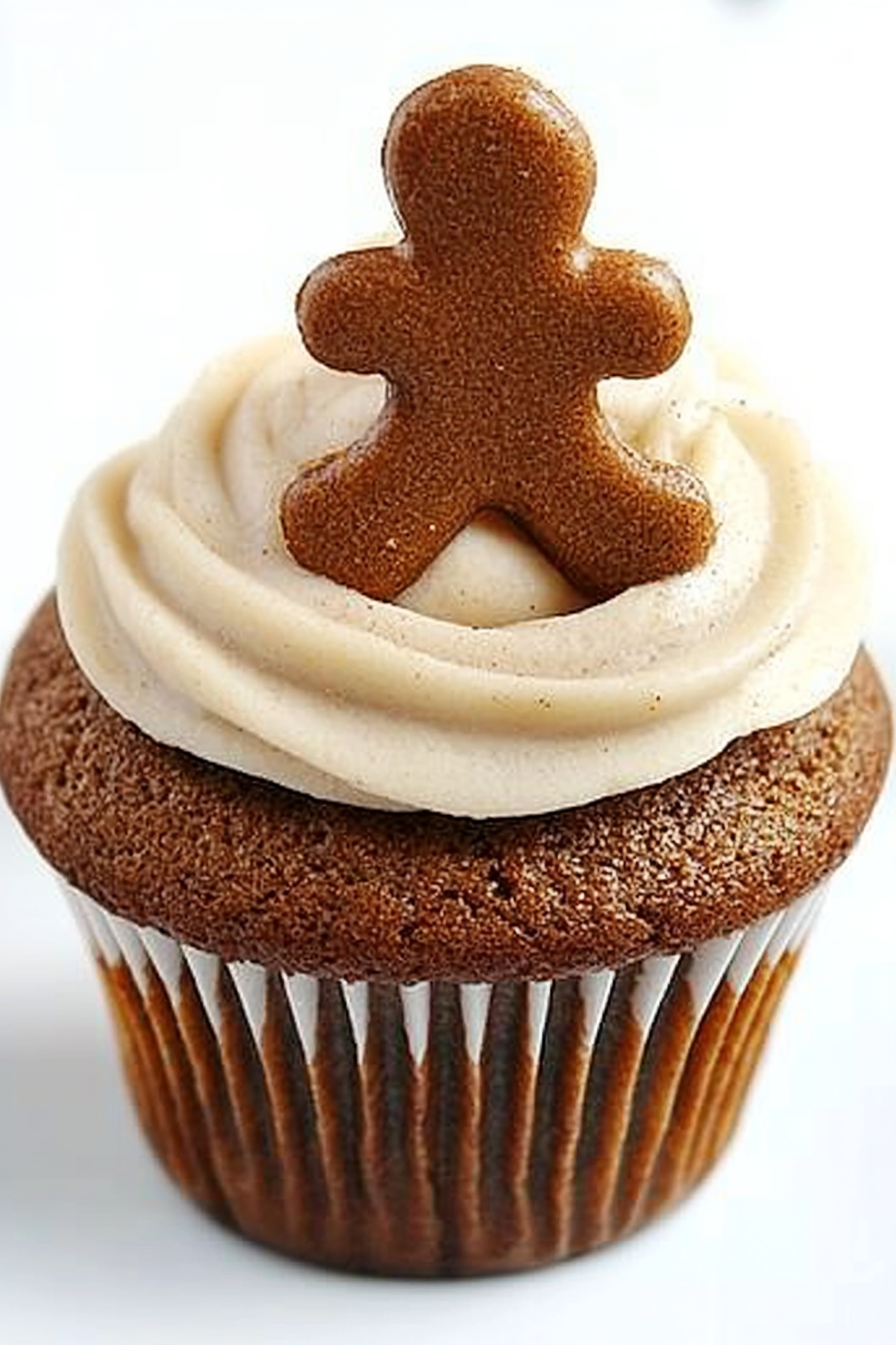 Gingerbread Cupcake with cinnamon cream cheese frosting, highlighted in foreground.