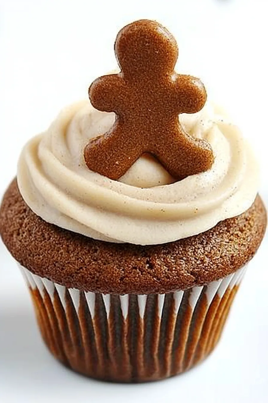 Gingerbread Cupcake with cinnamon cream cheese frosting, highlighted in foreground.