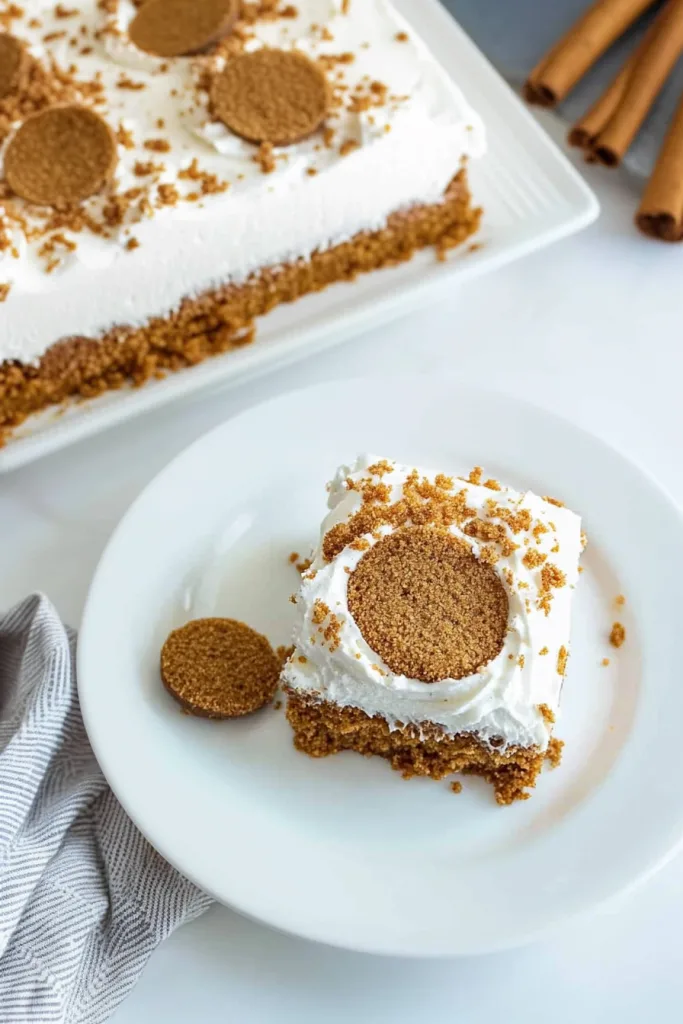 Slice of layered dessert with creamy filling and crumbly base.