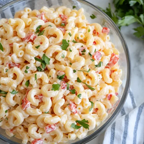 Final shot of Guy Fieri’s mac salad recipe, highlighting its creamy texture and vibrant colors.