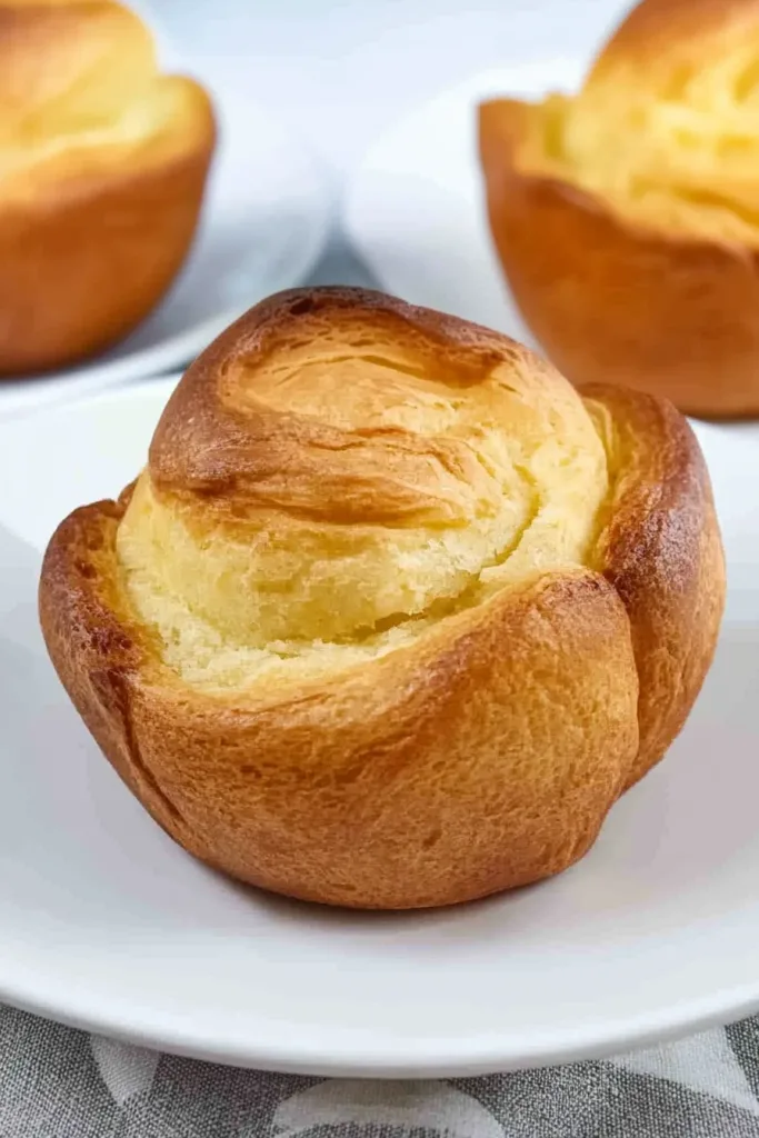 Close-up of fluffy baked pudding highlighting its rise and texture.