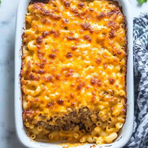 Mac and Cheese Meatloaf Casserole served hot with crisp edges and gooey center