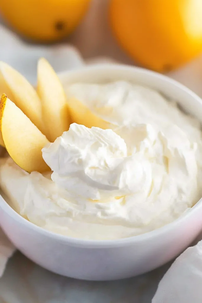 Smooth whipped dip paired with crisp apple slices and ripe pears for dipping