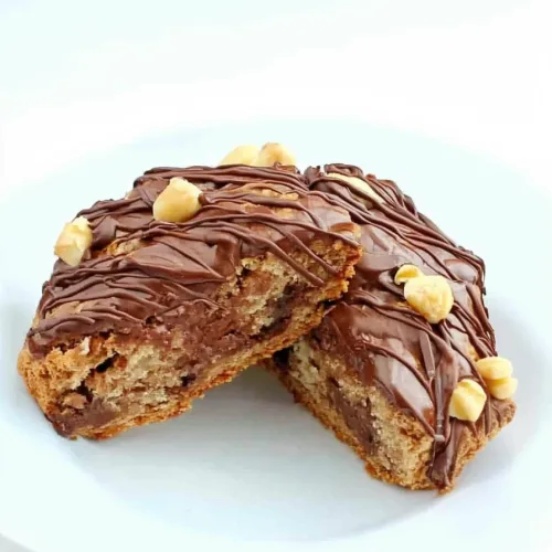 Plate of rich, nutty scones showcasing glossy chocolate glaze.