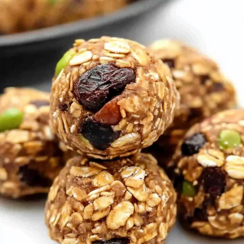 Cluster of homemade energy bites arranged neatly on a light background.