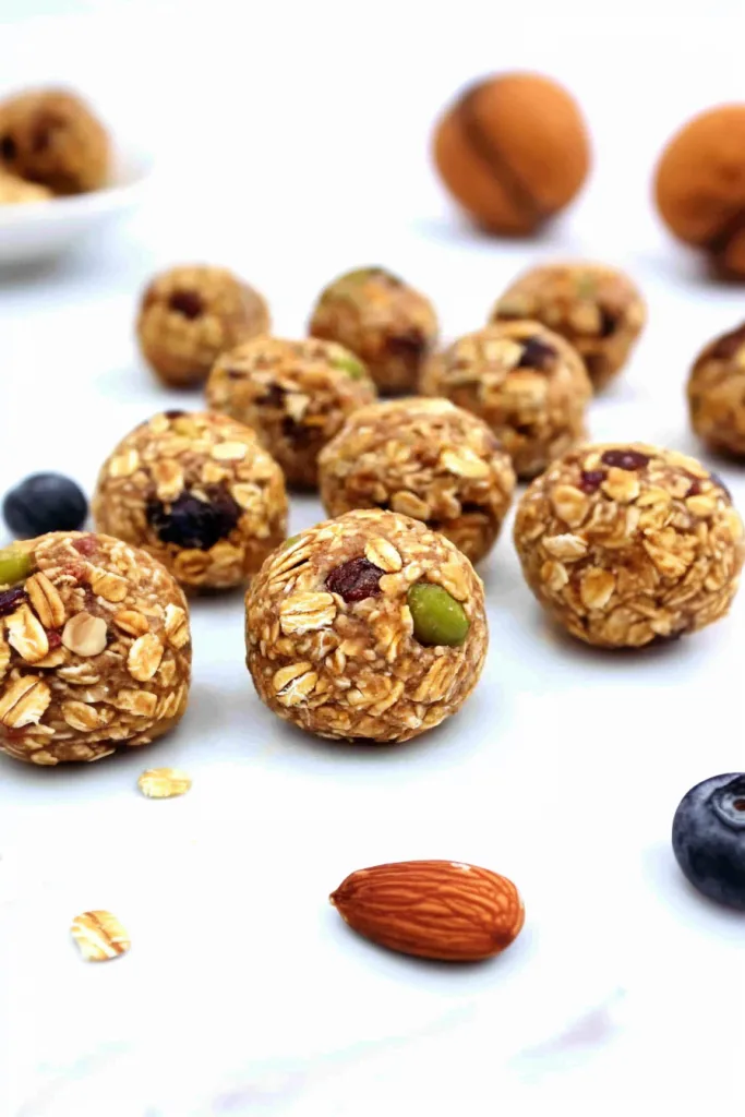 Round oat-based snack balls with raisins and seeds visible on the surface.