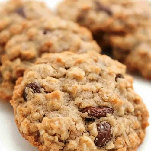 Freshly baked cookies arranged together, highlighting their uneven, homemade surface.