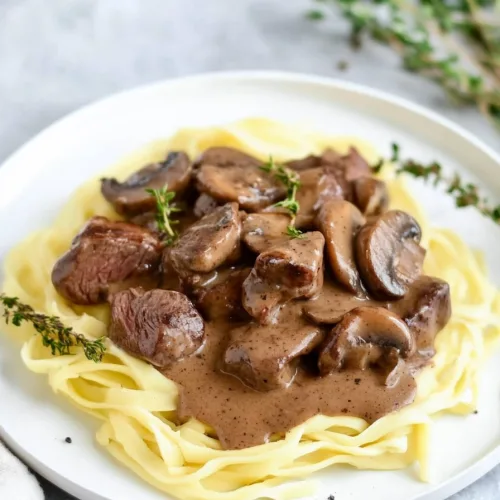 Homemade beef and mushroom gravy served as a comforting dinner entrรฉe