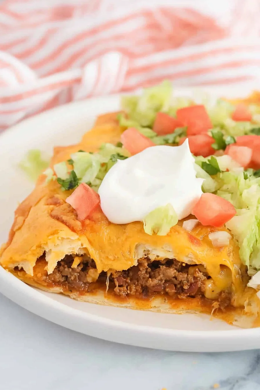 Hearty beef and cheese bake with flaky pastry crust, finished with sour cream and vegetables.