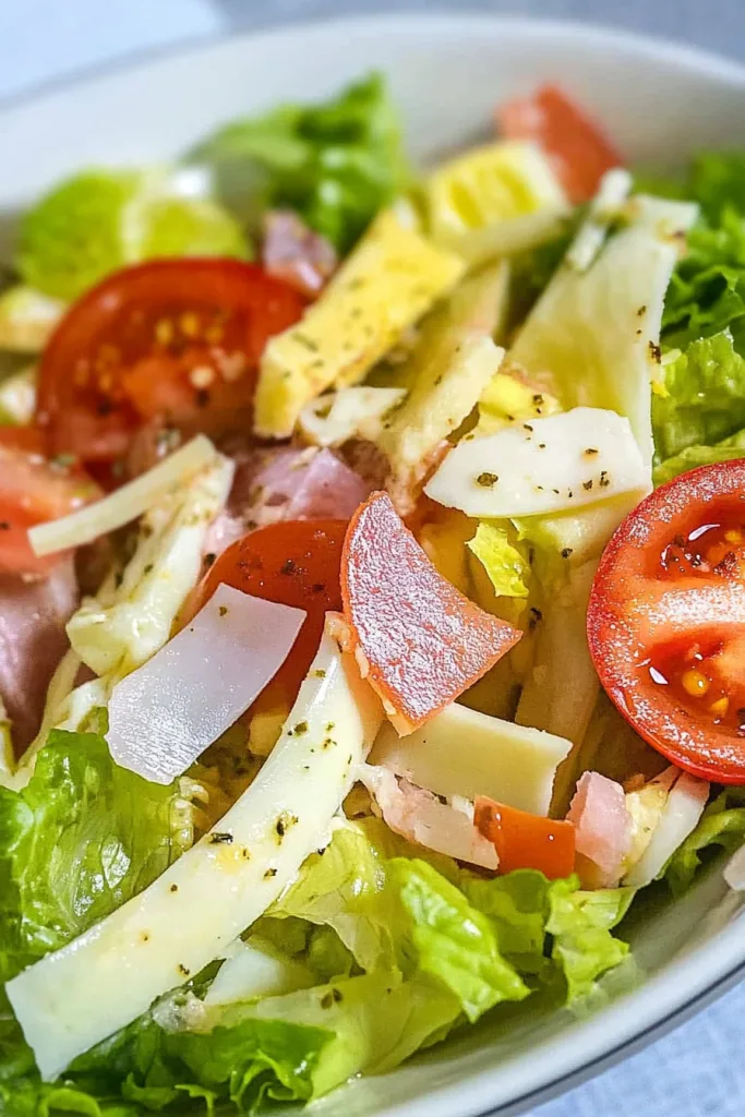 Colorful salad with boiled egg slices, seasoned with herbs and light dressing.
