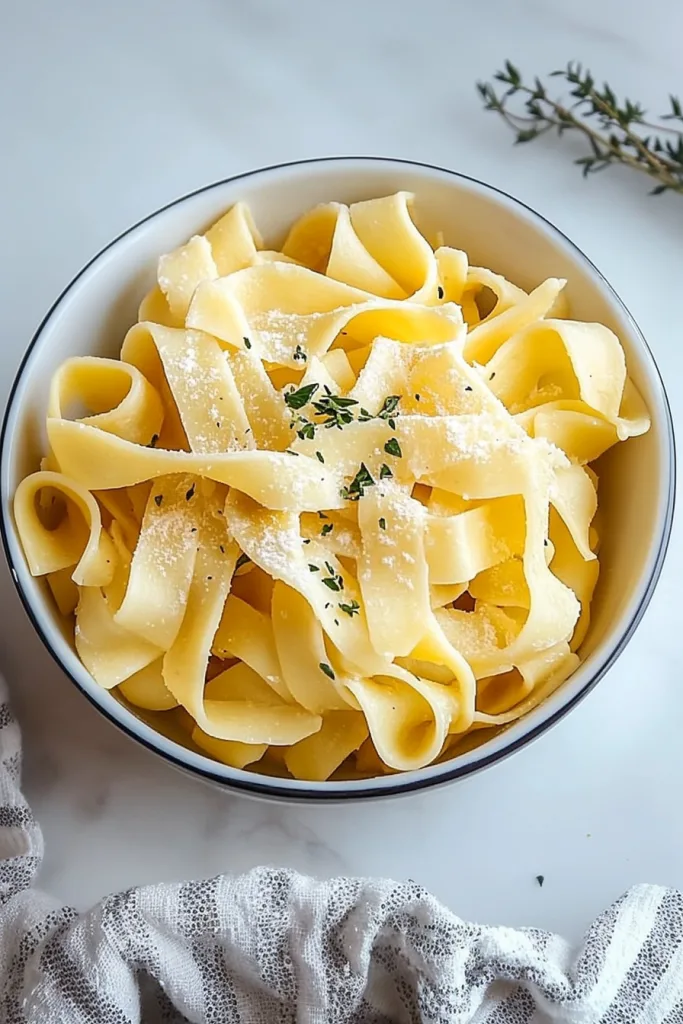 Golden noodles glistening with seasoning, ready to eat.