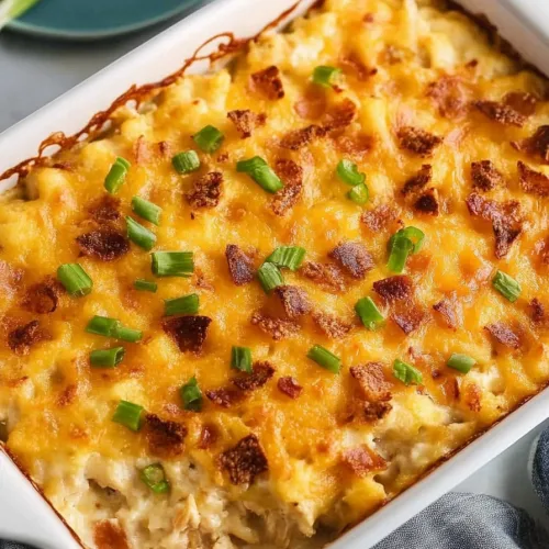 Freshly baked casserole in a dish, garnished with chopped scallions.