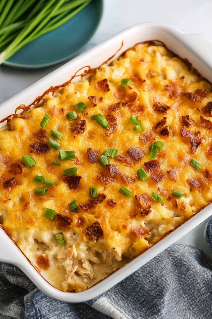 Freshly baked casserole in a dish, garnished with chopped scallions.