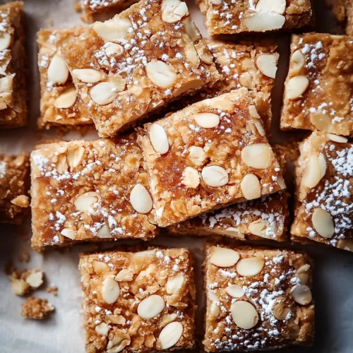 Nutty dessert squares highlighting texture and warm baked tones.