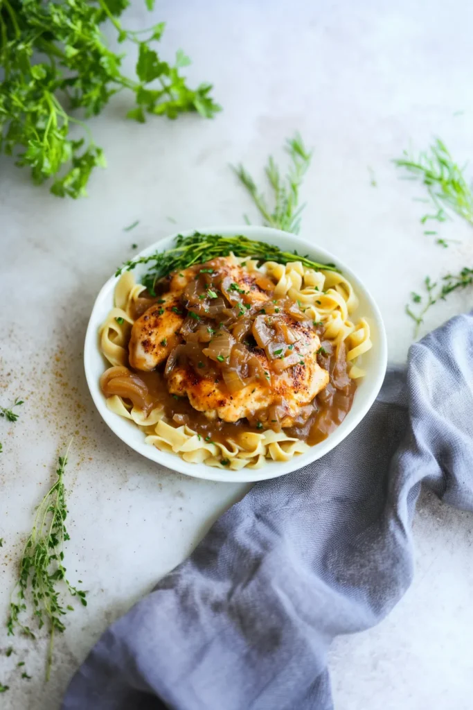 Comforting chicken dish garnished with fresh parsley.